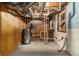 Unfinished basement space with exposed pipes, water heater, and electrical panel; ready for customization at 1702 Danrich Dr, Decatur, GA 30032