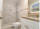 Updated bathroom featuring granite counters, a white vanity, and a tiled walk-in shower at 1702 Danrich Dr, Decatur, GA 30032