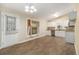 Open floor plan with white cabinets, wood-look floors, and granite countertops at 1702 Danrich Dr, Decatur, GA 30032