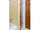 Close up of a tiled bathroom with a shower and wood door, showcasing classic design elements at 1905 Castleway Ne Ln, Atlanta, GA 30345