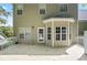 Rear elevation of home features a light wood deck and a sunroom at 313 Sable Trace Pass, Acworth, GA 30102
