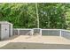 Spacious wooden back deck features a white picket fence and a storage shed at 313 Sable Trace Pass, Acworth, GA 30102