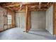 Unfinished basement with exposed framing and concrete floor awaiting your imagination and personal touches at 313 Sable Trace Pass, Acworth, GA 30102