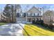 Charming two-story home boasts a manicured lawn, a two-car garage and inviting front porch at 313 Sable Trace Pass, Acworth, GA 30102