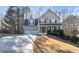 Traditional two-story home with a two-car garage, covered front porch and well-maintained lawn at 313 Sable Trace Pass, Acworth, GA 30102