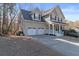 Charming two-story home boasts a two car garage, inviting front porch, and well-manicured landscaping at 313 Sable Trace Pass, Acworth, GA 30102