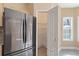 Bright kitchen with stainless appliances, large pantry, and window over the sink for plenty of natural light at 313 Sable Trace Pass, Acworth, GA 30102