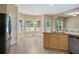 Bright kitchen boasts stainless steel appliances, double sink and breakfast area with large windows at 313 Sable Trace Pass, Acworth, GA 30102