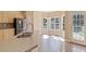 Kitchen boasts stainless steel appliances and a double sink with plenty of natural light at 313 Sable Trace Pass, Acworth, GA 30102