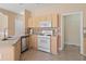 Kitchen with an island, stainless steel appliances, and ample cabinets, offering modern functionality at 313 Sable Trace Pass, Acworth, GA 30102