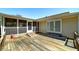 The back deck features ample space for entertaining, with access to the screened porch and backyard at 115 Heritage Cir, Mcdonough, GA 30253