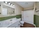 Well-lit bathroom with marble counter tops, updated fixtures, and a shower and tub combo at 115 Heritage Cir, Mcdonough, GA 30253
