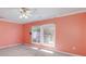 A bright, expansive bedroom enhanced by natural light from multiple windows, creating a warm ambiance at 115 Heritage Cir, Mcdonough, GA 30253