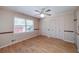 This cozy bedroom features two closets, a ceiling fan, and a window that lets in natural light at 115 Heritage Cir, Mcdonough, GA 30253