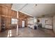 Spacious garage with exposed ceiling framing and shelving to accommodate storage needs at 115 Heritage Cir, Mcdonough, GA 30253