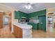 A kitchen featuring classic cabinets and an island with seating, with an easy flow to other spaces at 115 Heritage Cir, Mcdonough, GA 30253
