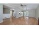 Open-concept living room with hardwood floors, high ceilings, and sliding glass doors to outdoor space at 115 Heritage Cir, Mcdonough, GA 30253