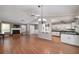 Spacious living room with hardwood floors, fireplace, adjoins kitchen at 115 Heritage Cir, Mcdonough, GA 30253