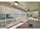 Relaxing screened porch with fans and serene views of the backyard at 115 Heritage Cir, Mcdonough, GA 30253