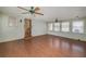Bright sunroom with hardwood floors, ceiling fans, and lots of windows offering plenty of natural light at 115 Heritage Cir, Mcdonough, GA 30253