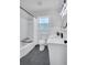 Updated bathroom with shower/tub combination, modern fixtures, and tiled floor at 1785 Hammond Woods Sw Cir, Marietta, GA 30008