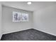 Bedroom with neutral decor, new carpet, and view to the outside at 1785 Hammond Woods Sw Cir, Marietta, GA 30008