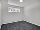 Bedroom with neutral decor, new carpet, and window view at 1785 Hammond Woods Sw Cir, Marietta, GA 30008