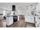Well-lit kitchen with stainless steel appliances, lots of storage space, and a view to the living room at 1785 Hammond Woods Sw Cir, Marietta, GA 30008