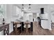 Modern kitchen with a center island and seating, stainless steel appliances, and hardwood flooring at 1785 Hammond Woods Sw Cir, Marietta, GA 30008