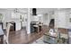 Bright living room featuring an open-concept floor plan, wood floors, and stairs to the second floor at 1785 Hammond Woods Sw Cir, Marietta, GA 30008