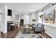 Cozy living room showcases an open-concept, hardwood floors, modern furnishings, and plenty of natural light at 1785 Hammond Woods Sw Cir, Marietta, GA 30008