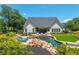 A private backyard oasis features a pool, spa, lounging area, and lush landscaping for ultimate relaxation and enjoyment at 201 Edwards Brook Ct, Canton, GA 30115