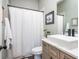 Bathroom with a sink, toilet, vanity and white shower curtain at 201 Edwards Brook Ct, Canton, GA 30115