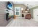 Unique bedroom featuring wood paneled walls, a TV, guitar, and sitting area with shelving at 201 Edwards Brook Ct, Canton, GA 30115