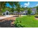 Expansive property showing the home's exterior, three car garage, and lush green lawn at 201 Edwards Brook Ct, Canton, GA 30115