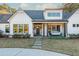 Inviting front porch featuring a cozy porch swing and stone pathway to the entrance at 201 Edwards Brook Ct, Canton, GA 30115