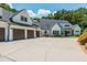 Beautiful two-story home boasting an attached three-car garage and a welcoming front porch swing at 201 Edwards Brook Ct, Canton, GA 30115