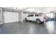 Spacious garage with an epoxy floor and ample room for vehicles and storage at 201 Edwards Brook Ct, Canton, GA 30115