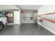 This garage features storage cabinets, a ladder rack, and space for parking with a rugged, non-slip flooring finish at 201 Edwards Brook Ct, Canton, GA 30115