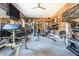 Home gym with sleek wood walls and a wide variety of equipment including weights and machines at 201 Edwards Brook Ct, Canton, GA 30115
