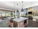 Open kitchen with island overlooks the dining and living areas, offering a seamless flow for entertaining at 201 Edwards Brook Ct, Canton, GA 30115