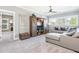 Comfortable living room with sectional sofa, entertainment cabinet, and view to connected room at 201 Edwards Brook Ct, Canton, GA 30115