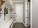 Well-organized mudroom featuring custom built-ins, hooks, and a convenient bench with storage at 201 Edwards Brook Ct, Canton, GA 30115