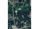 A beautiful aerial view of a property and its surrounding woods at 3550 Gravitt Rd, Cumming, GA 30040