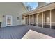 Relax on this large back deck and screened-in porch with wooded views; great for entertaining at 3550 Gravitt Rd, Cumming, GA 30040