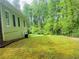 Spacious backyard with green grass, ideal for outdoor activities and relaxation at 3550 Gravitt Rd, Cumming, GA 30040