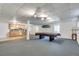 Finished basement area with a pool table and a kitchenette, offering flexible living space at 3550 Gravitt Rd, Cumming, GA 30040