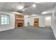 Finished basement with a cozy fireplace, neutral paint, and recessed lighting at 3550 Gravitt Rd, Cumming, GA 30040