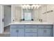 Bathroom features a double sink vanity, a large mirror, and modern fixtures at 3550 Gravitt Rd, Cumming, GA 30040