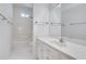 Clean bathroom featuring a single sink vanity with a large mirror and a tub/shower combo at 3550 Gravitt Rd, Cumming, GA 30040